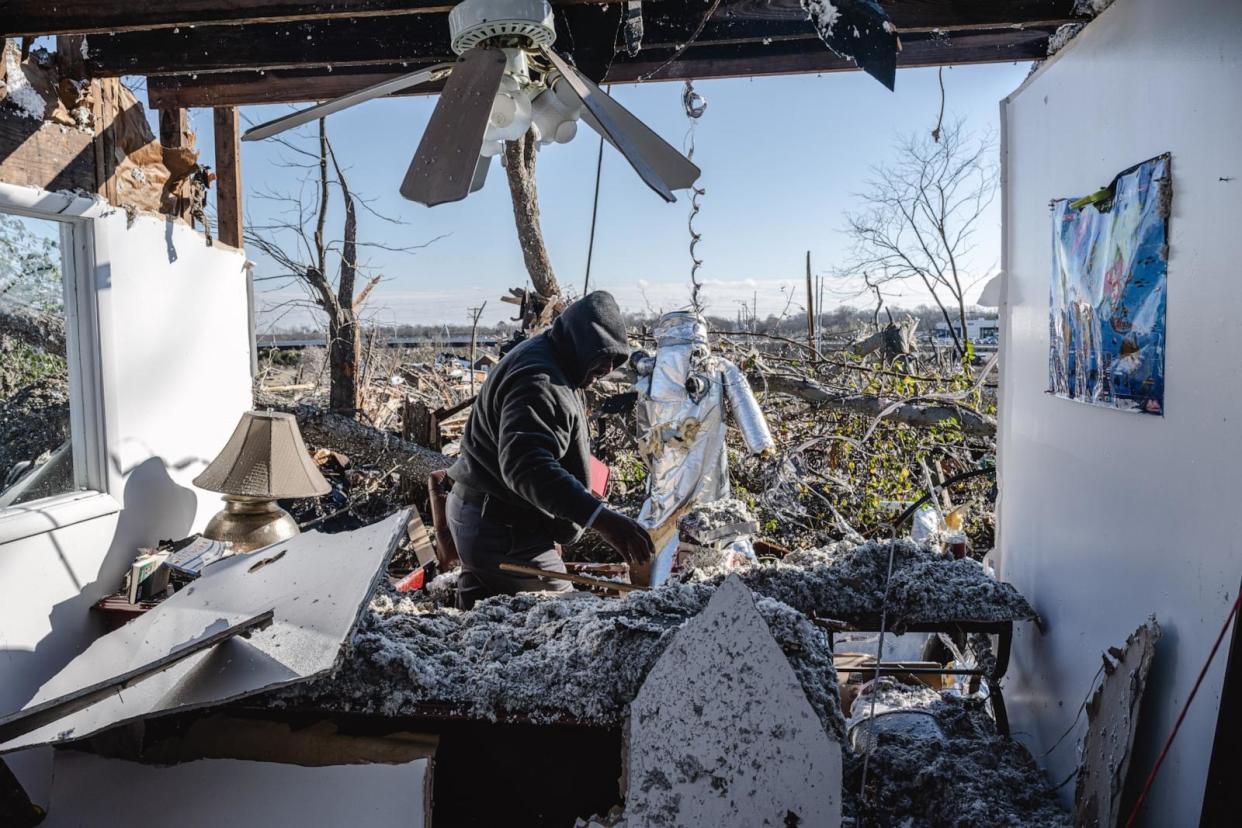 PHOTO: Ronald Harris searches the office of Sabbath Day Church of God in Christ in the aftermath of a tornado, Dec. 10, 2023, in Madison, Tenn. (Jon Cherry/Getty Images)