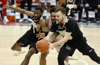 Purdue forward Aaron Wheeler, left, and guard Sasha Stefanovic, right, reach for a loose ball against Ohio State guard Musa Jallow, center, during the second half of an NCAA college basketball game in Columbus, Ohio, Tuesday, Jan. 19, 2021. (AP Photo/Paul Vernon)