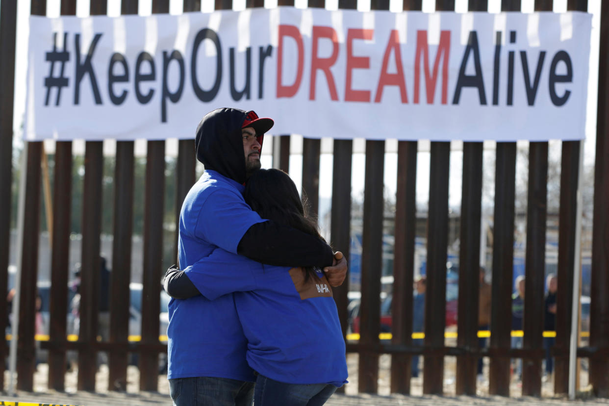 "Dreamers" hug as they meet with relatives during the "Keep Our Dream Alive" binational meeting at a new section of the border wall on the U.S.-Mexico border on Dec. 10, 2017. (Photo: Jose Luis Gonzalez / Reuters)