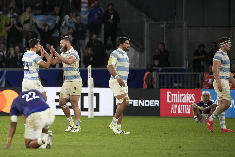 Argentina's players celebrates after the end of the Rugby World Cup Pool D match between Argentina and Samoa at the Stade Geoffroy Guichard in Saint-Etienne, France, Friday, Sept. 22, 2023. (AP Photo/Laurent Cipriani)