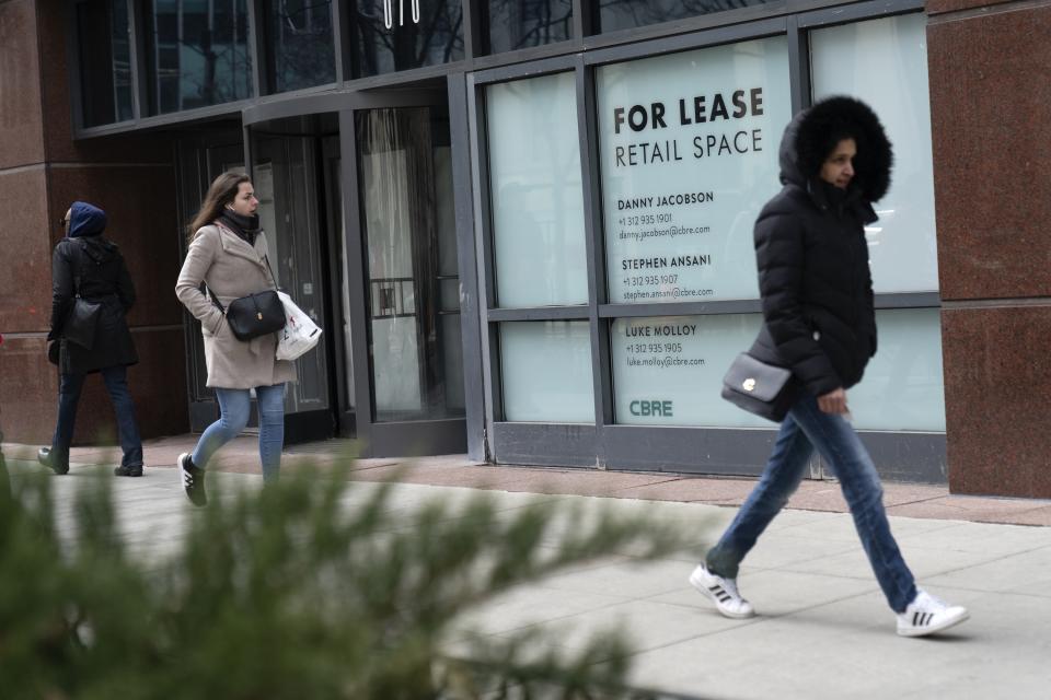 Retail space is vacant along Michigan Avenue Thursday, March 23, 2023, in Chicago. Along the iconic shopping and tourist strip known as the Magnificent Mile, storefronts sit vacant, casualties of the pandemic, crime and retail trends that were moving away from in-person shopping even before COVID-19. (AP Photo Erin Hooley)