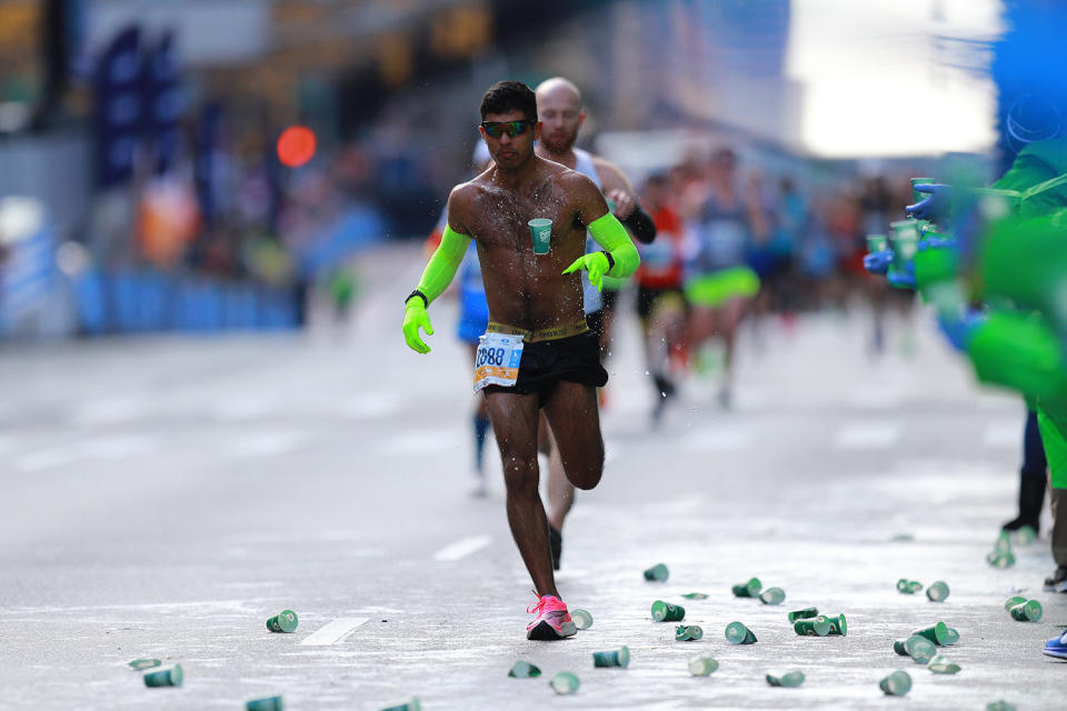 A participant runs up First Avenue, passing the 16-mile mark of the 2019 New York City Marathon. (Photo: Gordon Donovan/Yahoo News)
