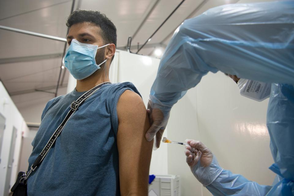 Michael Ruggiero, 26 of Old Bridge, receives the Monkeypox vaccine in Paramus, N.J. on Thursday Aug. 4, 2022. Monkeypox vaccines released from the U.S. Strategic National Stockpile are given to eligible New Jersey residents at Bergen New Bridge Medical Center in Paramus to help prevent the spread of the once-rare disease. 