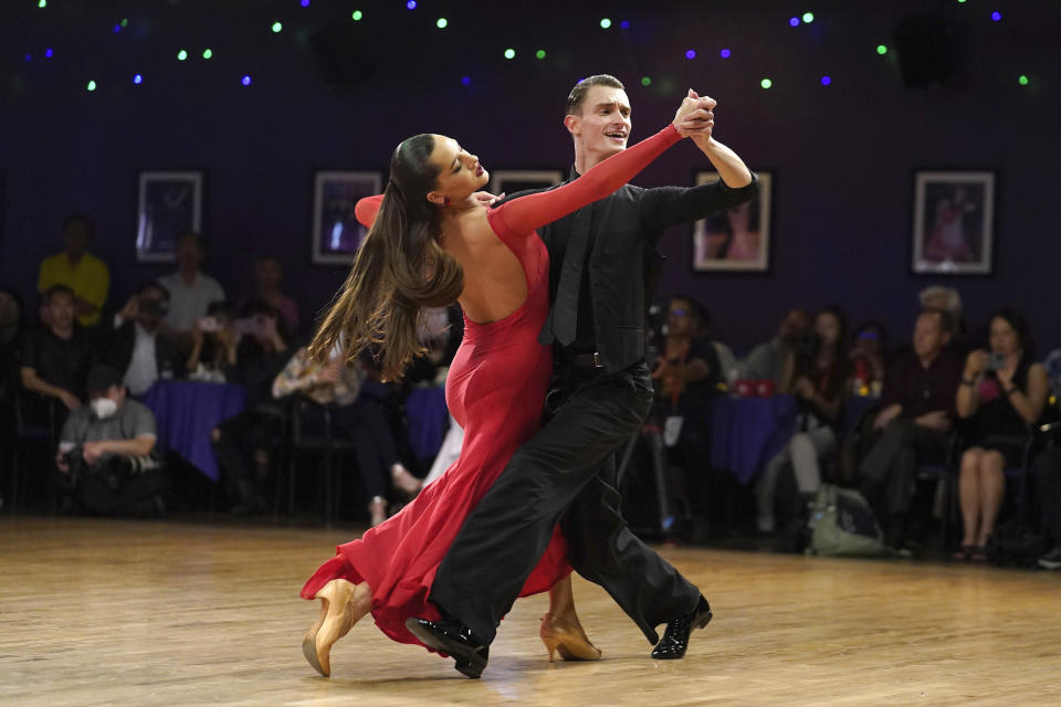 Pro dancers and teachers, Kristi Semochko, and Vlad Ogurstov perform at the Lai Lai Ballroom and Studio in Alhambra, Calif., on Saturday, May 20, 2023. The Community Dance is a celebration of Asian American Pacific Islander (AAPI) Heritage Month, hosted by Brandon Tsay, who disarmed a mass shooter during Lunar New Year celebrations at his family's dance studio. (AP Photo/Damian Dovarganes)