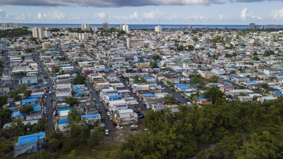 The San Juan neighborhood of&nbsp;Mart&iacute;n Pe&ntilde;a is regularly flooded by a canal that sends trash, rats and human feces through the streets. (Photo: Miami Herald via Getty Images)
