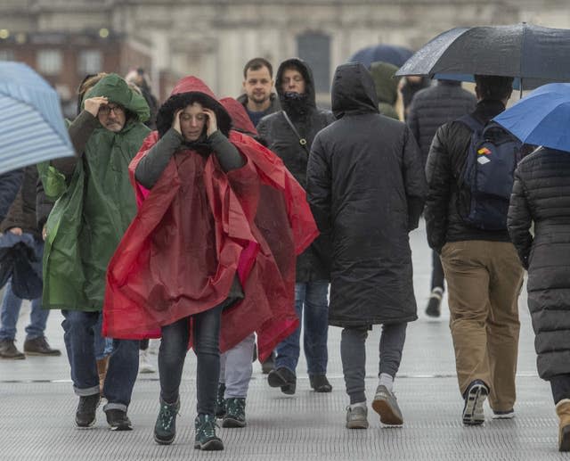 People crossing the Millennium Bridge in London