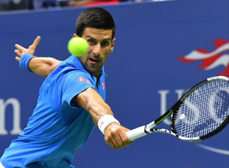 Novak Djokovic of Serbia hits to Kyle Edmund of the UK. Mandatory Credit: Robert Deutsch-USA TODAY Sports