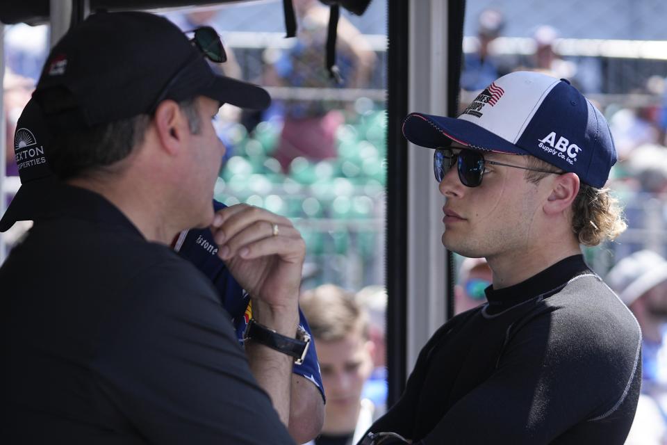 Santino Ferrucci talks with his crew following the final practice for the Indianapolis 500 auto race at Indianapolis Motor Speedway, Friday, May 26, 2023, in Indianapolis. (AP Photo/Darron Cummings)