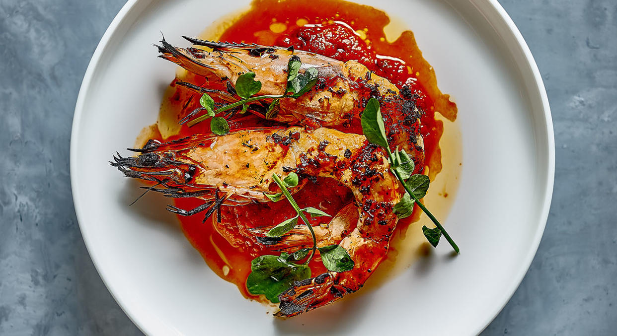 Prawns with Split Tomato, Saffron and Currant Sauce. Photo: David Griffen