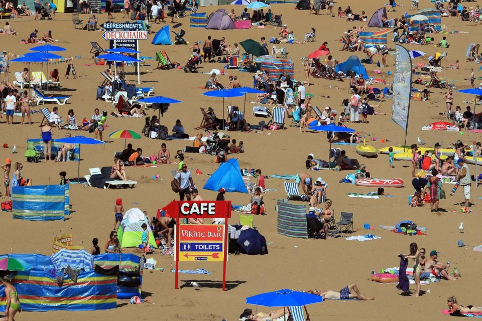 People enjoy the sunny weather on the beach in Broadstairs, Kent: PA