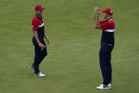 Team USA assistant captain Jim Furyk applauds Justin Thomas after the Ryder Cup matches at the Whistling Straits Golf Course Sunday, Sept. 26, 2021, in Sheboygan, Wis. (AP Photo/Jeff Roberson)