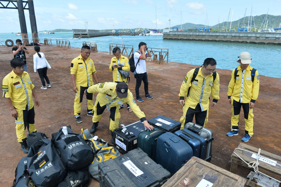 Chinese rescue workers prepare equipments before a search operation for missing passengers of a capsized tourist boat at a pier in Phuket, Thailand, July 7, 2018. (REUTERS)