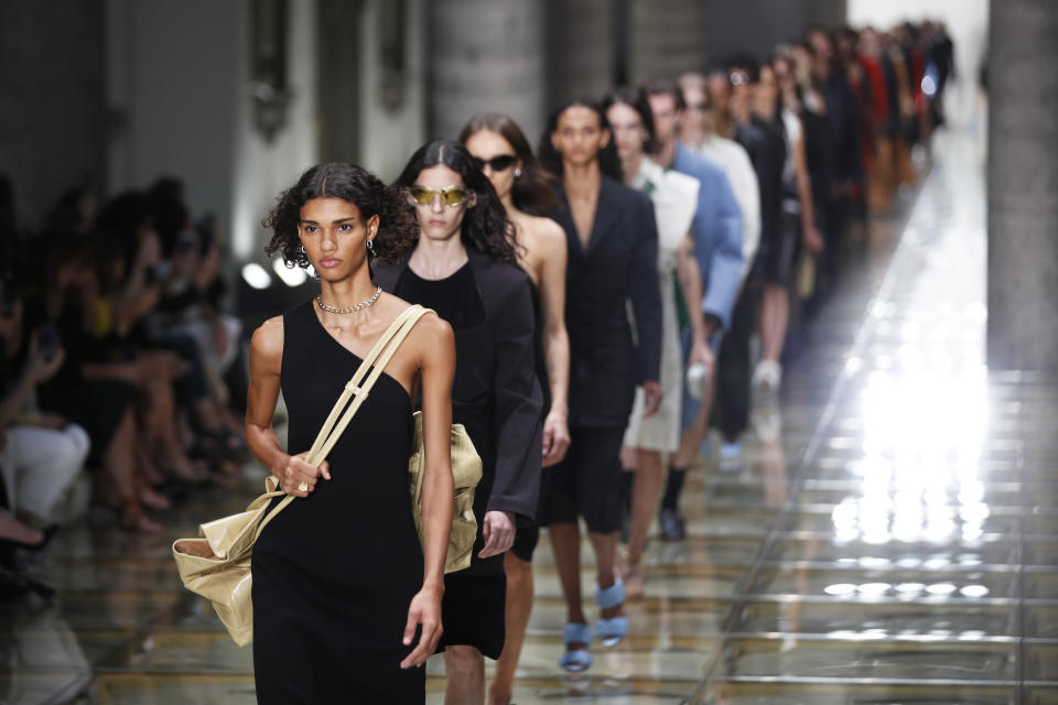 Models wear creations as part of the Bottega Veneta Spring-Summer 2020 collection, unveiled during the fashion week, in Milan, Italy, Thursday, Sept. 19, 2019. (AP Photo/Antonio Calanni)