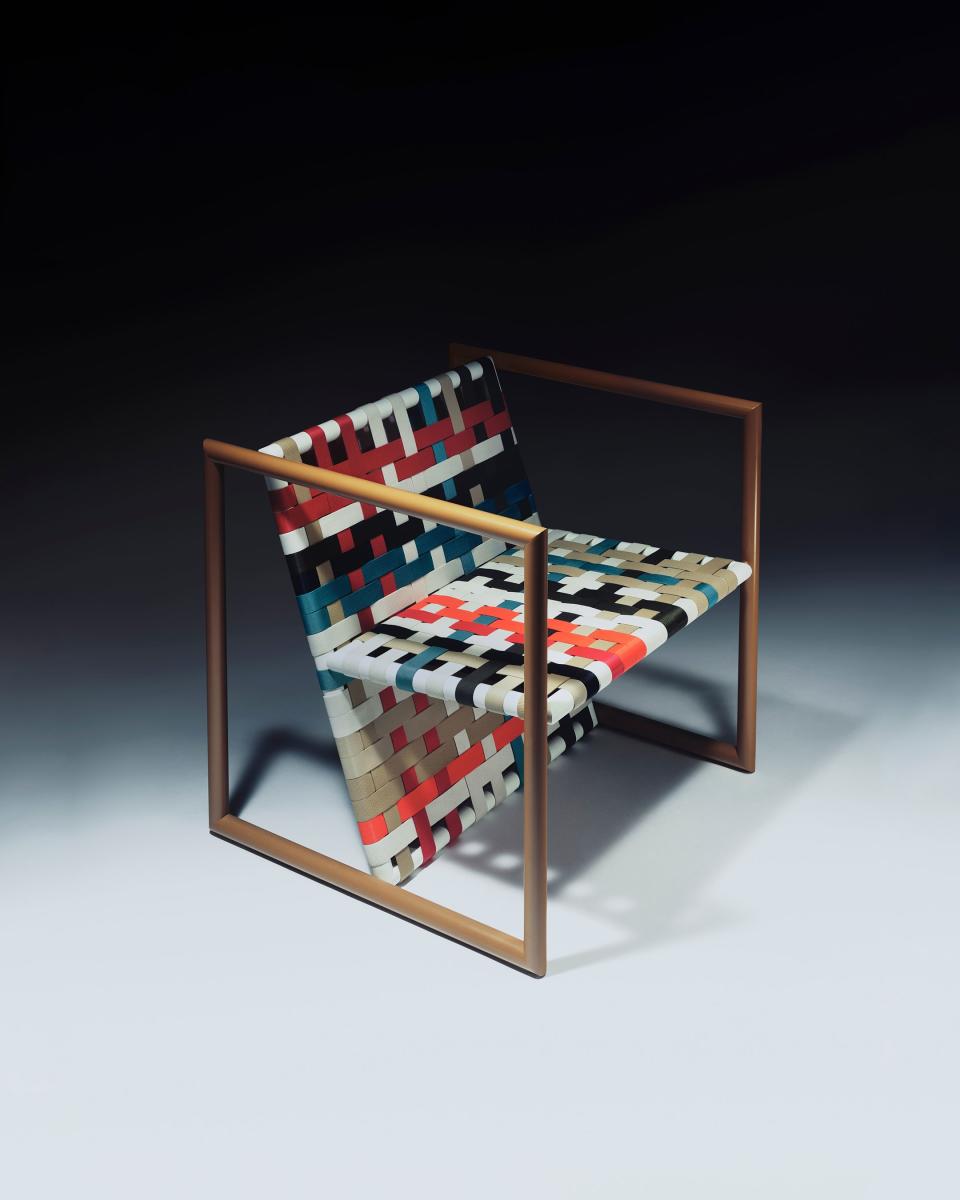 Jonathan's work with tubular steel was inspired by the Bauhaus, one of his favorite design movements. This armchair (which we would love to have) plays with color in a beautiful latticework of nylon webbing.