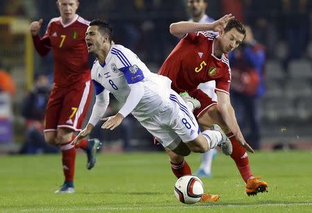 Israel's Beram Kayal is tackled by Belgium's Jan Vertonghen (R) during their Euro 2016 group B qualifying soccer match at King Baudouin stadium in Brussels, October 13, 2015. REUTERS/Francois Lenoir