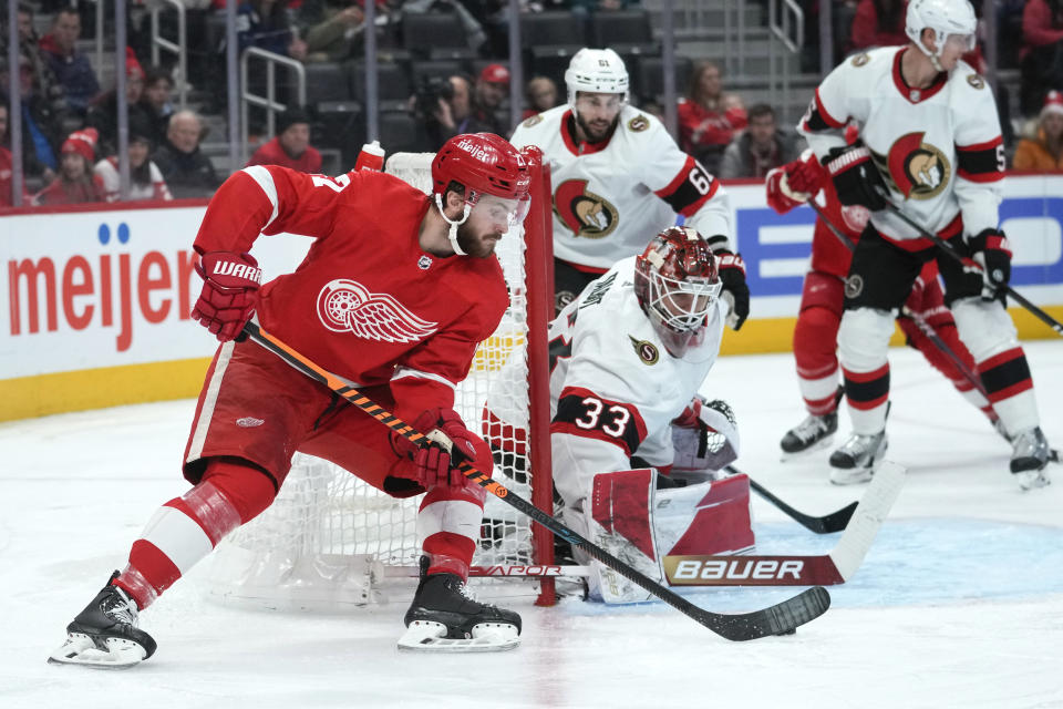 Ottawa Senators goaltender Cam Talbot (33) stops a Detroit Red Wings center Michael Rasmussen (27) shot in the second period of an NHL hockey game Saturday, Dec. 17, 2022, in Detroit. (AP Photo/Paul Sancya)