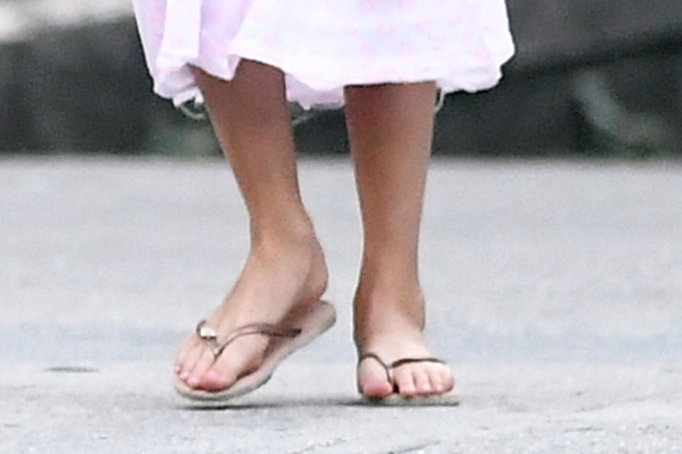 A closer look at Suri Cruise’s gold flip-flops. - Credit: Splash News