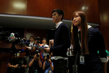 Pro-independence legislator-elects Yau Wai-ching (R) and Baggio Leung meet reporters after the president of the legislature delayed the swearing-in of the two in Hong Kong, China October 25, 2016. REUTERS/Bobby Yip