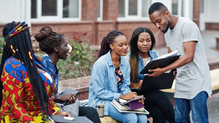 A group of African college students spends time together. Madison College in Wisconsin, looking to expand its curriculum and boost international enrollment, has established a partnership with Kenya’s Rift Valley Institute of Business Studies and will do the same this month with the University of Gambia. (Photo: AdobeStock)
