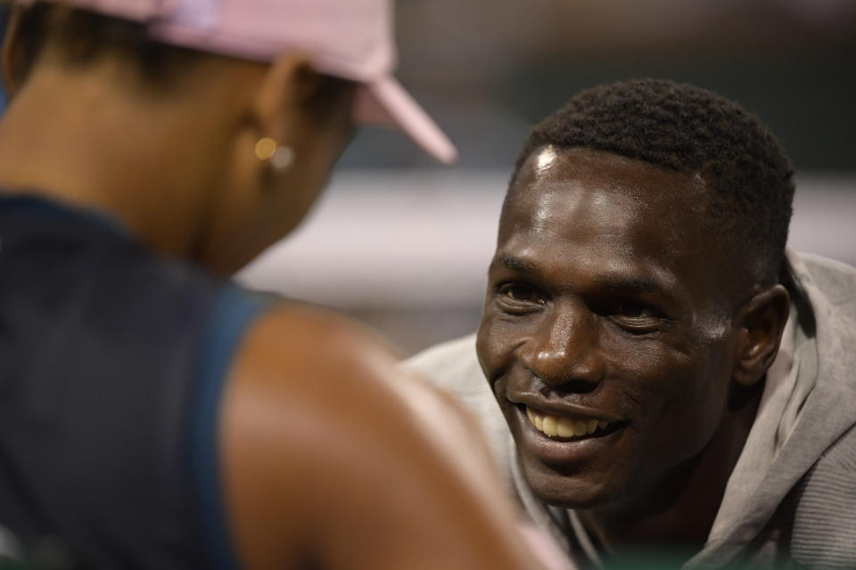 Naomi Osaka, of Japan, left, speaks with her coach Jermaine Jenkins after the match against Belinda Bencic at the BNP Paribas Open tennis tournament Tuesday, March 12, 2019 in Indian Wells, Calif. (AP Photo/Mark J. Terrill)