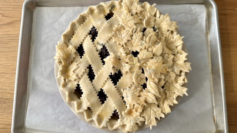 unbaked pie on baking sheet