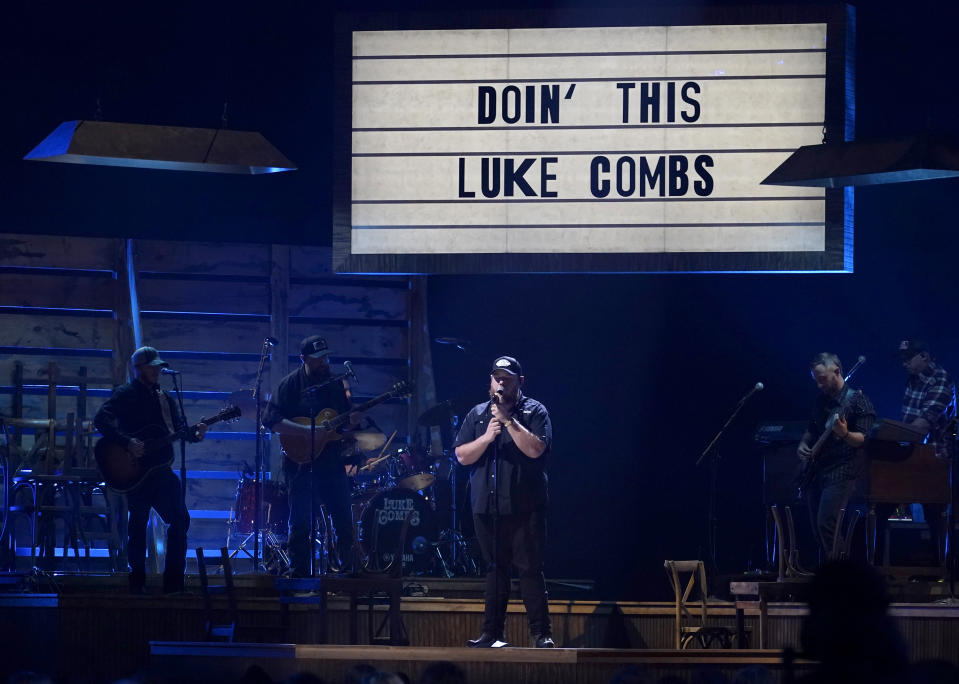 Luke Combs performs "Doin' This" at the 55th annual CMA Awards on Wednesday, Nov. 10, 2021, at the Bridgestone Arena in Nashville, Tenn. (AP Photo/Mark Humphrey)