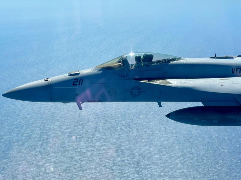 Navy Lt. Arielle Ash is shown in the F-18 she flies out of Naval Air Station Lemoore in Hanford, Calif. Ash is the lead pilot on an all-women's Super Bowl LVII flyover on Sunday.