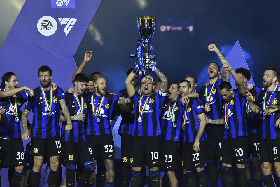 Inter Milan's players celebrate with the trophy after they won the Italian Super Cup final soccer match between Inter Milan and Napoli at Al Awwal Park Stadium in Riyadh, Saudi Arabia, Monday, Jan. 22, 2024. (AP Photo)