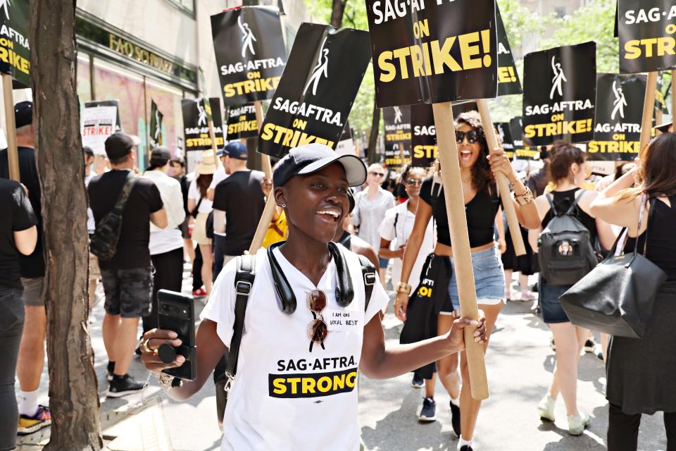 Lupita Nyong'o joins SAG-AFTRA members on the picket line outside of 30 Rockefeller Plaza in New York City.