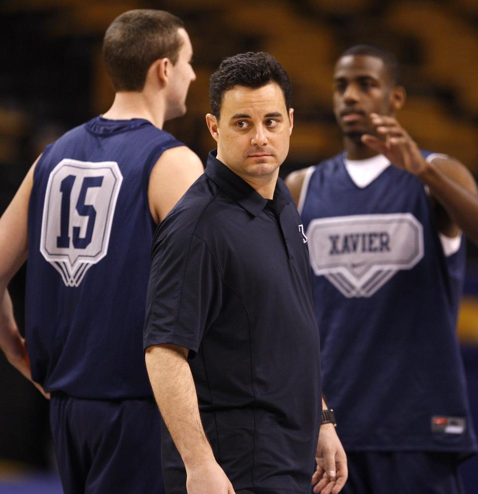 Dante Jackson, right, was recruited by and played for Sean Miller, center, at Xavier. Now, Jackson's one of Miller's assistant coaches at Xavier.