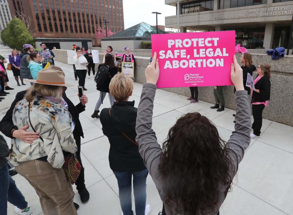 Abortion rights advocates protest in downtown Akron Tuesday following the leaked U.S. Supreme Court decision that would reverse Roe V. Wade.