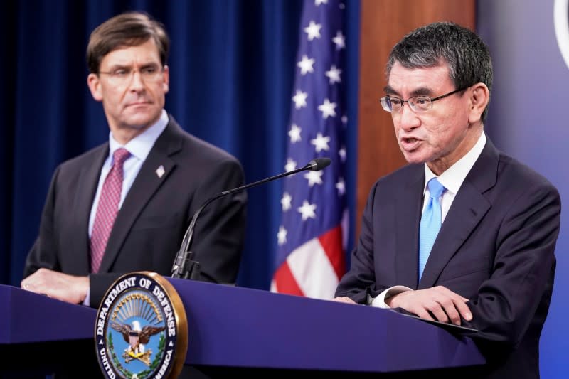 U.S. Secretary of Defense Mark Esper looks on as Japan's Defense Minister Taro Kono speaksduring a joint news conference at the Pentagon in Washington