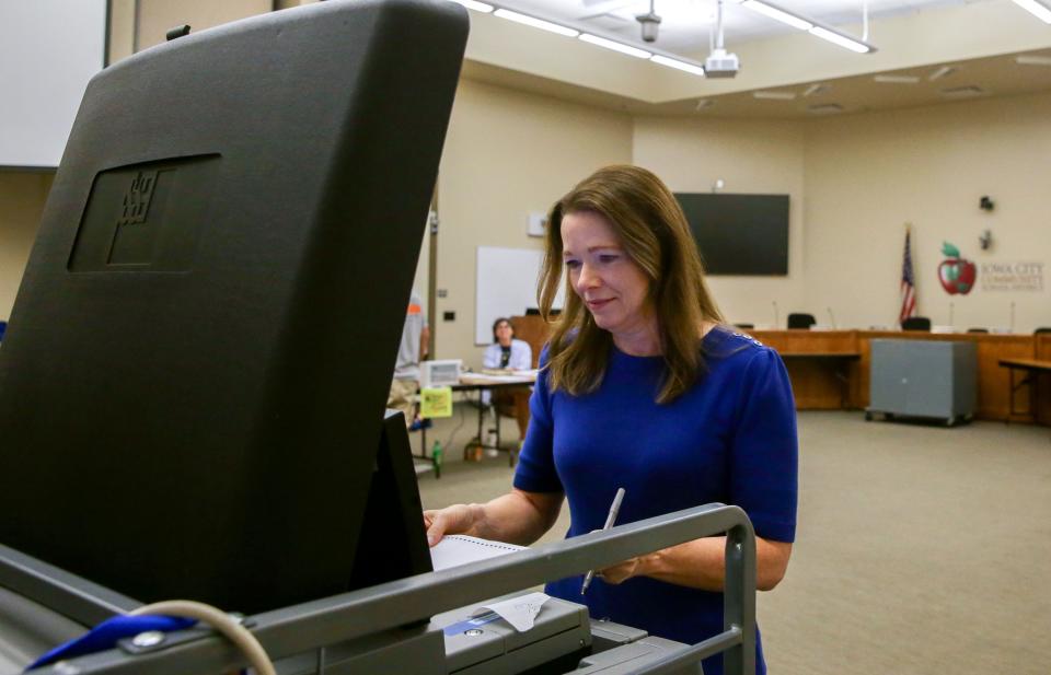 Democratic candidate for Iowa’s 1st Congressional District Christina Bohannan submits her ballot after voting at the Iowa City Community School District’s administrative building Tuesday, June 4, 2024 in Iowa City, Iowa.