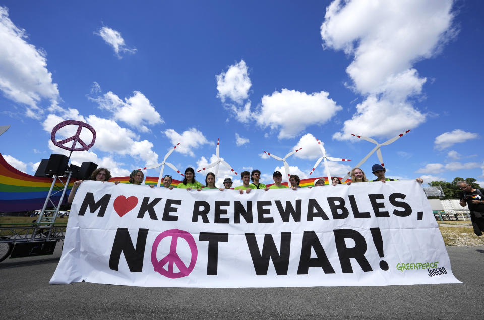 Protestors hold a banner as they march during a demonstration ahead of the G7 meeting in Munich, Germany, Saturday, June 25, 2022. The G7 Summit will take place at Castle Elmau near Garmisch-Partenkirchen from June 26 through June 28, 2022. (AP Photo/Martin Meissner)