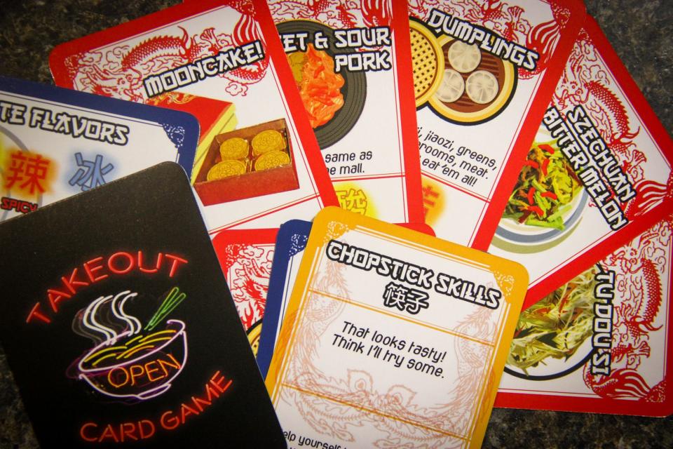 Takeout, a card game by Small Monsters Games, features colorful playing cards inspired by Chinese restaurants. The creators of Small Monsters are based in Fall River, and sell their decks locally.