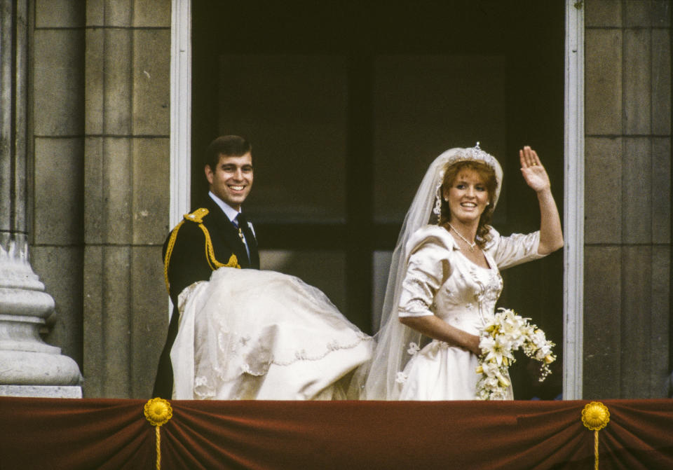 On the balcony of Buckingham Palace, Prince Andrew, Duke of York and Sarah, Duchess of York wave to well-wishers after their wedding, London, England, July 23, 1986.