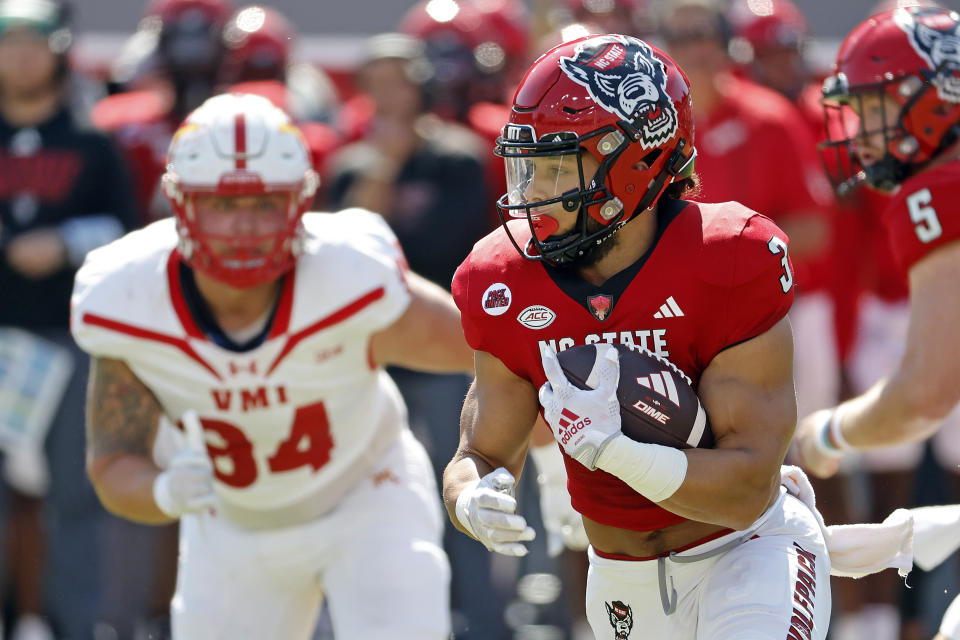 North Carolina State's Jordan Houston (3) runs the ball during the first half of an NCAA college football game against VMI in Raleigh, N.C., Saturday, Sept. 16, 2023. (AP Photo/Karl B DeBlaker)