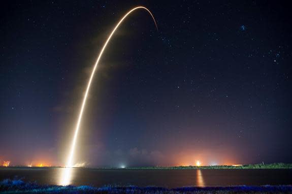 A SpaceX Falcon 9 rocket streaks toward space from Florida's Cape Canaveral Air Force Station in this spectacular long-exposure view of the company's successful Dragon cargo ship launch toward the International Space Station for NASA on Sept. 2