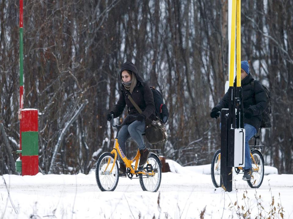 Two refugees attempt to cross the Norwegian border in the nearby town of Storskog (Getty Images)