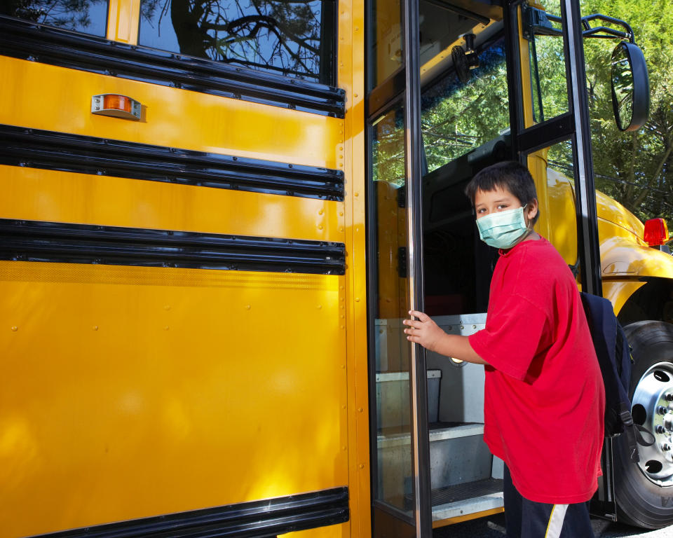 Masks and hand sanitizer are key to school-bus safety this fall, say experts. (Photo: Getty Images)