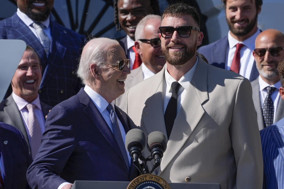 President Joe Biden, left, talks with Kansas City Chiefs tight end Travis Kelce, right, during an event with the Super Bowl-champion Kansas City Chiefs on the South Lawn of the White House, Friday, May 31, 2024, to celebrate their championship season and victory in Super Bowl LVIII. (AP Photo/Evan Vucci)