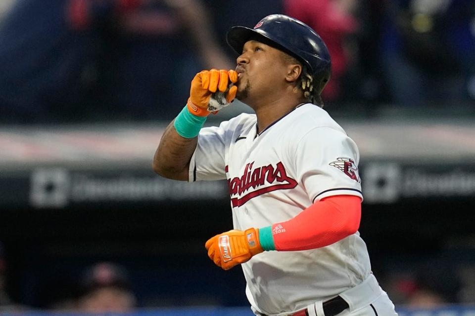 Cleveland goaltenders' Jose Ramirez gestures as he approaches home plate with his third home run of the night, during the sixth inning of a baseball game against the Boston Red Sox, Thursday, June 8 2023, in Cleveland.  (AP Photo/Sue Ogrocki)