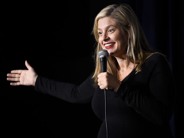 <p>Michael S. Schwartz/Getty</p> Tom Segura's wife Christina Pazsitzky performs during her appearance at The Ice House Comedy Club on May 12, 2018 in Pasadena, California.