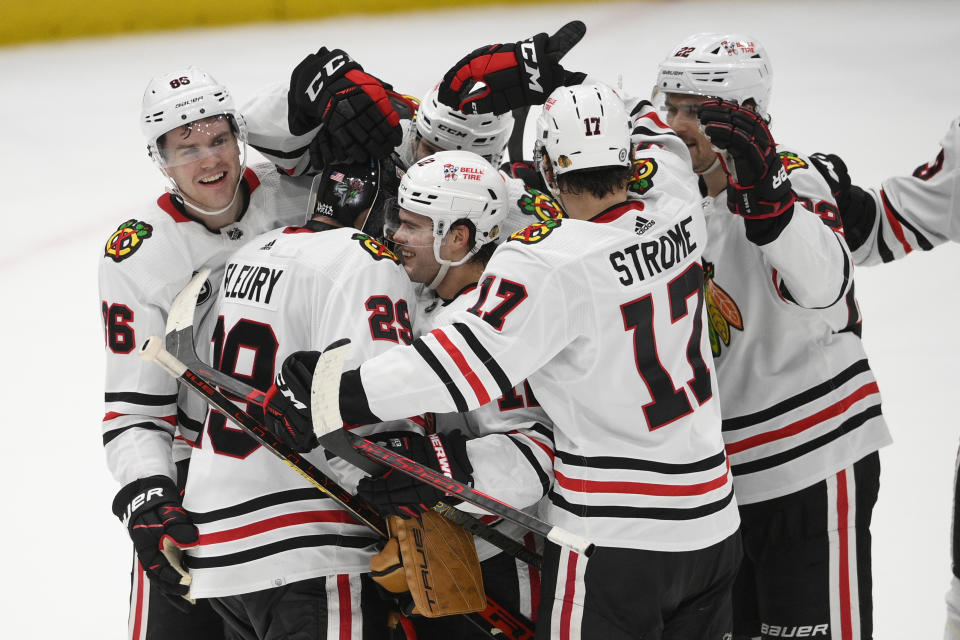 Chicago Blackhawks goaltender Marc-Andre Fleury (29) celebrates with teammates after an NHL hockey game against the Washington Capitals, Thursday, Dec. 2, 2021, in Washington. The Blackhawks won 4-3 in a shootout. (AP Photo/Nick Wass)