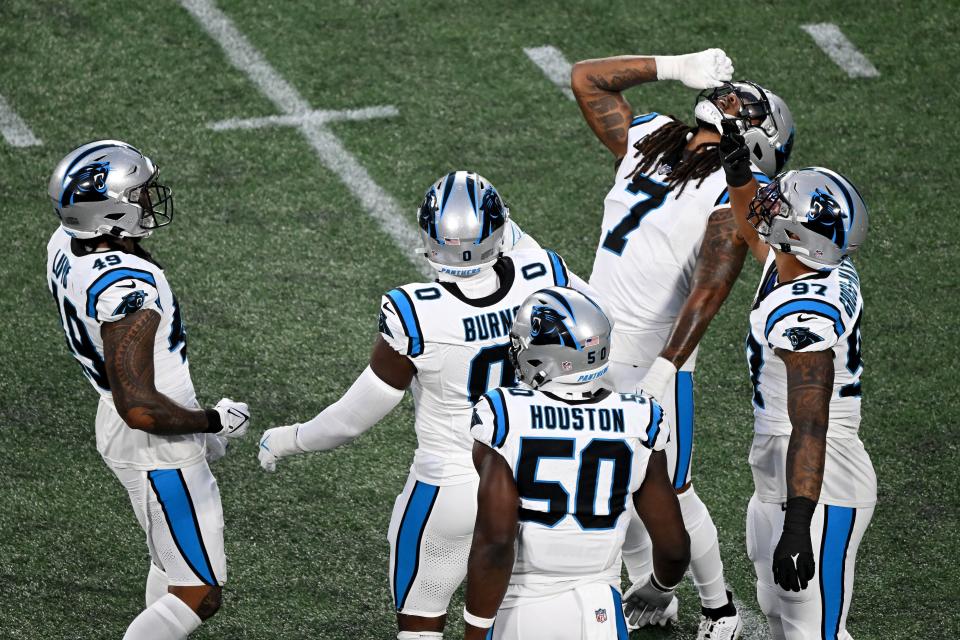 CHARLOTTE, NORTH CAROLINA - SEPTEMBER 18: Frankie Luvu #49 of the Carolina Panthers celebrates with his teammates after sacking Derek Carr #4 of the New Orleans Saints during the first quarter in the game at Bank of America Stadium on September 18, 2023 in Charlotte, North Carolina. (Photo by Grant Halverson/Getty Images)