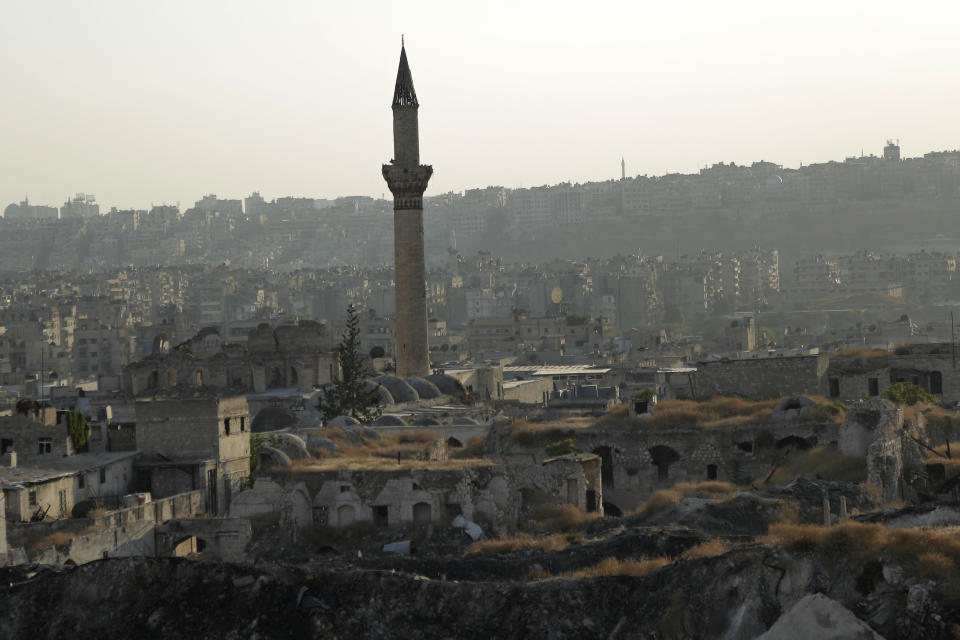 In this Saturday, July 27, 2019 photo, A general view shows the old city of Aleppo, Syria. Much of Aleppo's centuries-old covered market is still in ruins but slowly small parts of it have been renovated where business is slowly coming back to normal nearly three years after major battles in Syria's largest city and once commercial center came to an end. (AP Photo/Hassan Ammar)