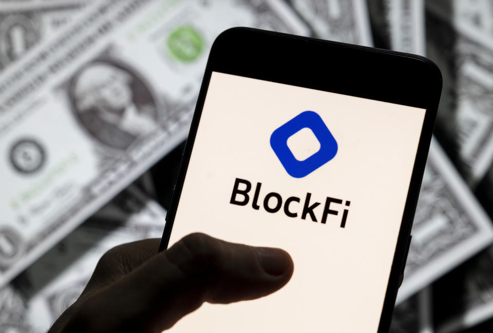 CHINA - 2021/04/14: In this photo illustration, the cryptocurrency exchange trading platform Blockfi logo is seen on an Android mobile device screen with the currency of the United States dollar icon, $ icon symbol in the background. (Photo Illustration by Chukrut Budrul/SOPA Images/LightRocket via Getty Images)