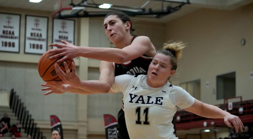 Brown center, Gianna Aiello, denies Yale guard Klara Astrom from a rebound under the Bears' hoop in the second half.