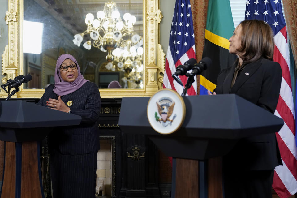FILE - Tanzanian President Samia Suluhu Hassan meets with Vice President Kamala Harris in Harris' ceremonial office in the Eisenhower Executive Office Building on the White House campus, April 15, 2022, in Washington. Harris will try to deepen and reframe U.S. relationships in Africa during a weeklong trip that begins Saturday, the latest and highest profile outreach by the Biden administration as it moves to counter China's growing influence. (AP Photo/Patrick Semansky, File)