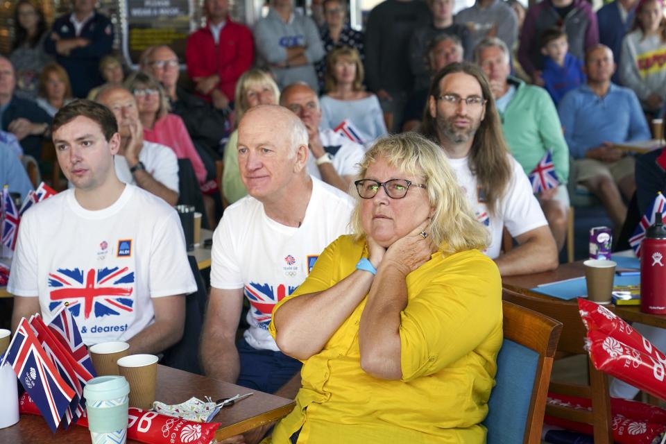 Eilidh McIntyre’s fiance Jonny Forer (left), father Mike McIntyre, and mother Caroline McIntyre watch on the big screen at Hayling Island Sailing Club (Steve Parsons/PA) (PA Wire)